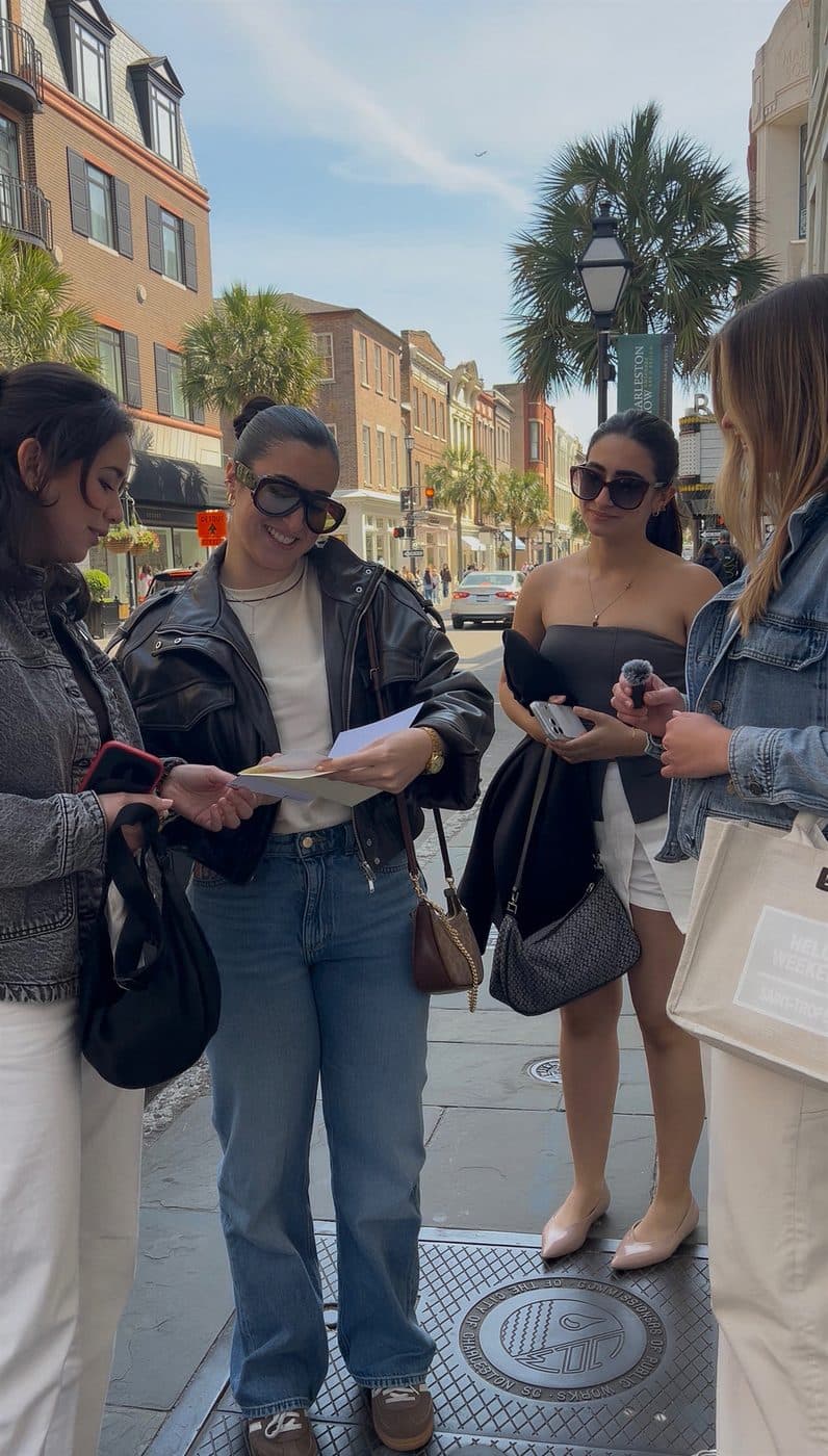 A group of friends opening a P.S. card in Charleston