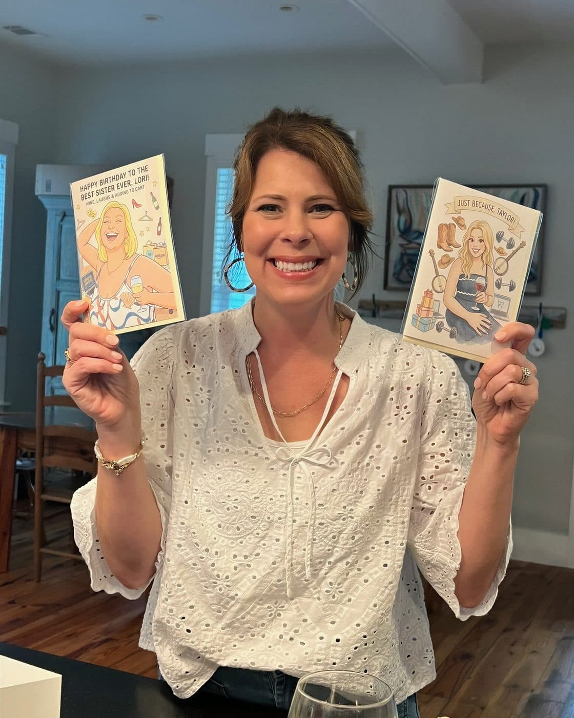 A real person holding personalized P.S. cards