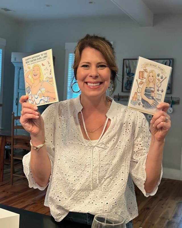 A real person holding personalized P.S. cards