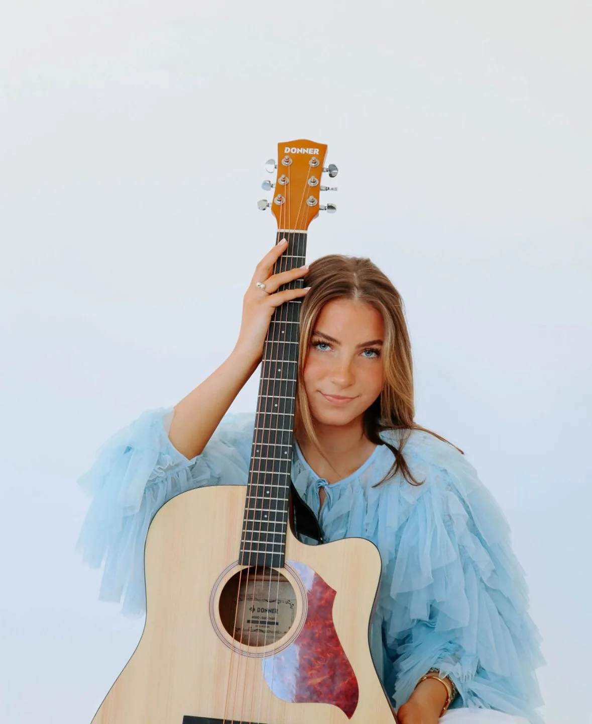 Charleston singer-songwriter Grace Miller with her guitar