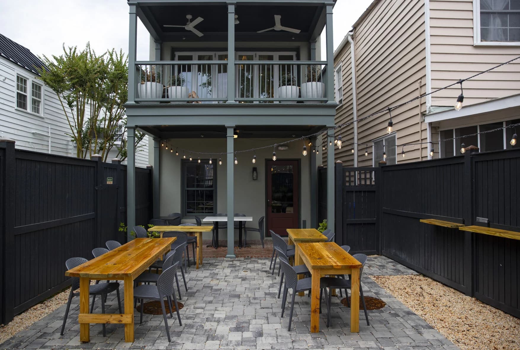Sonder Wine Bar's private courtyard with tables and string lights